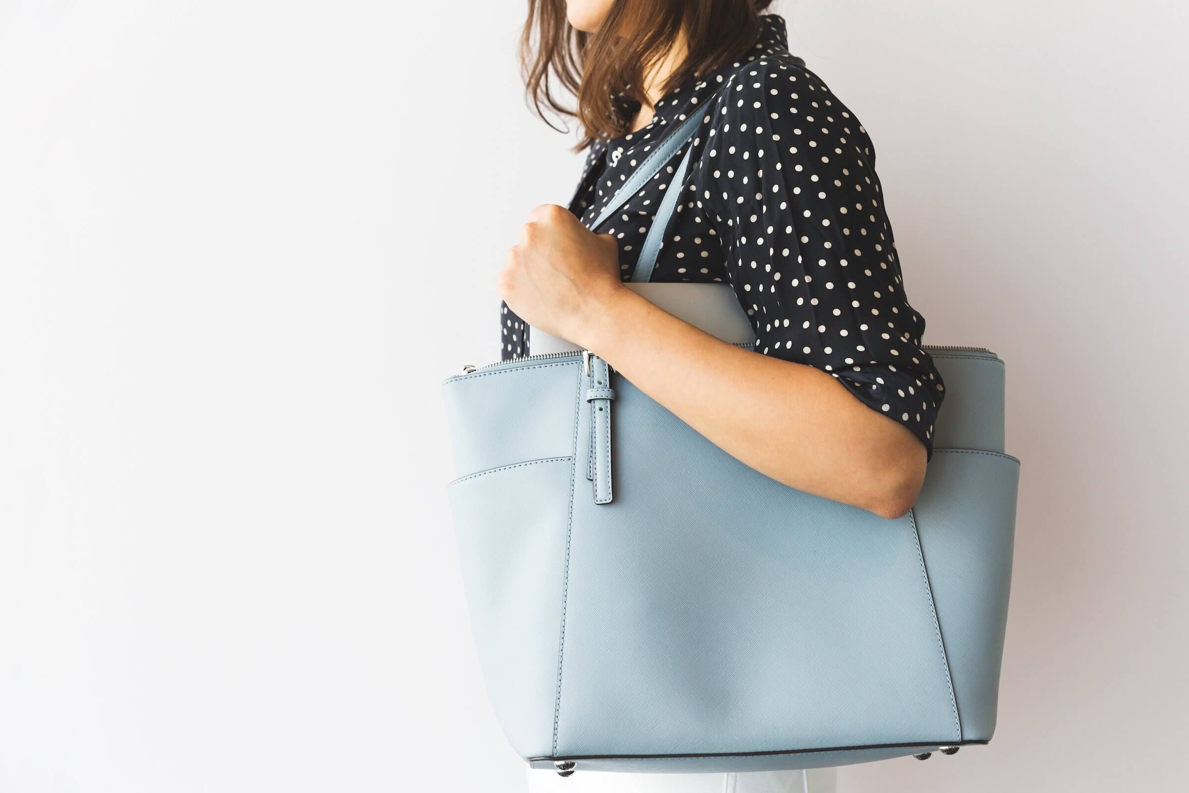 woman holding handbag who has decided what to take to an interview